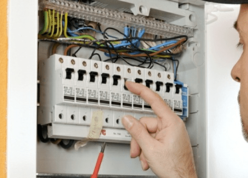 Electrician checking switches